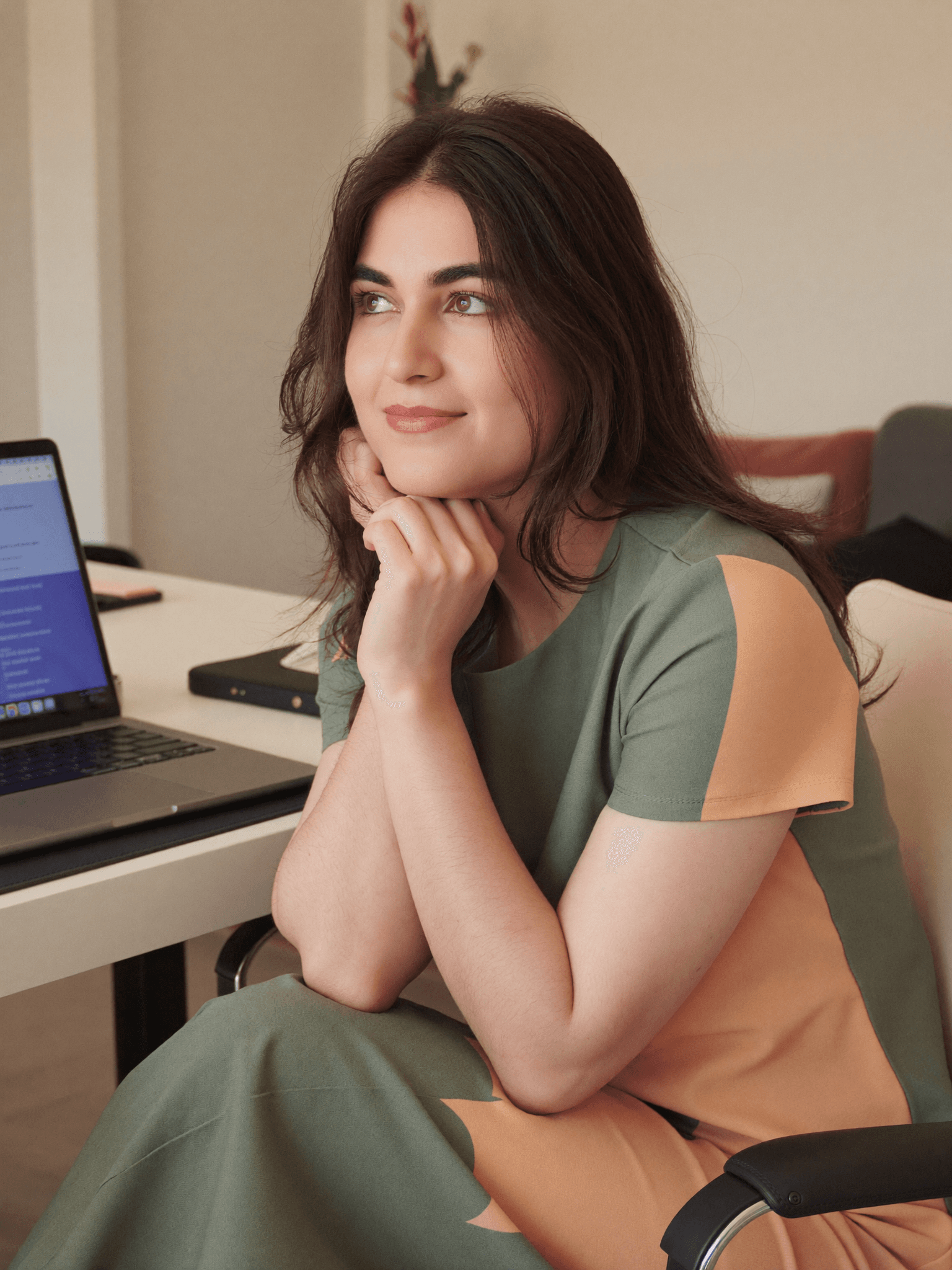 Shomaila working at her desk